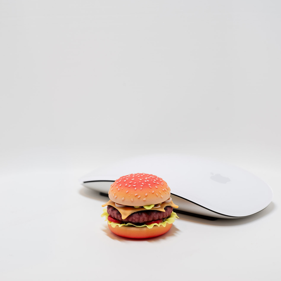 Full-color cheeseburger print next to a computer mouse for scale