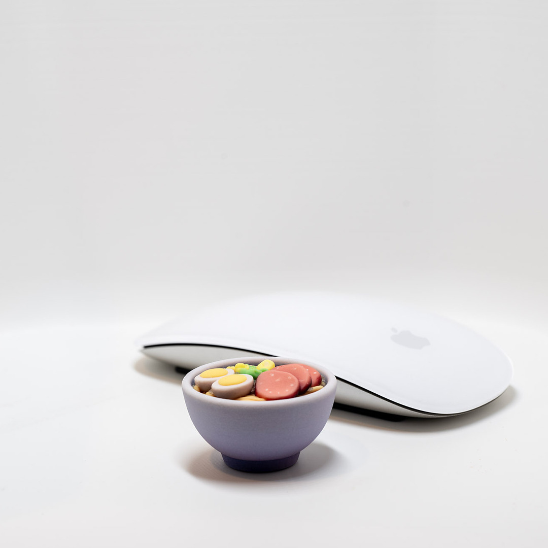 Full-color bowl of macarons print next to a computer mouse for scale