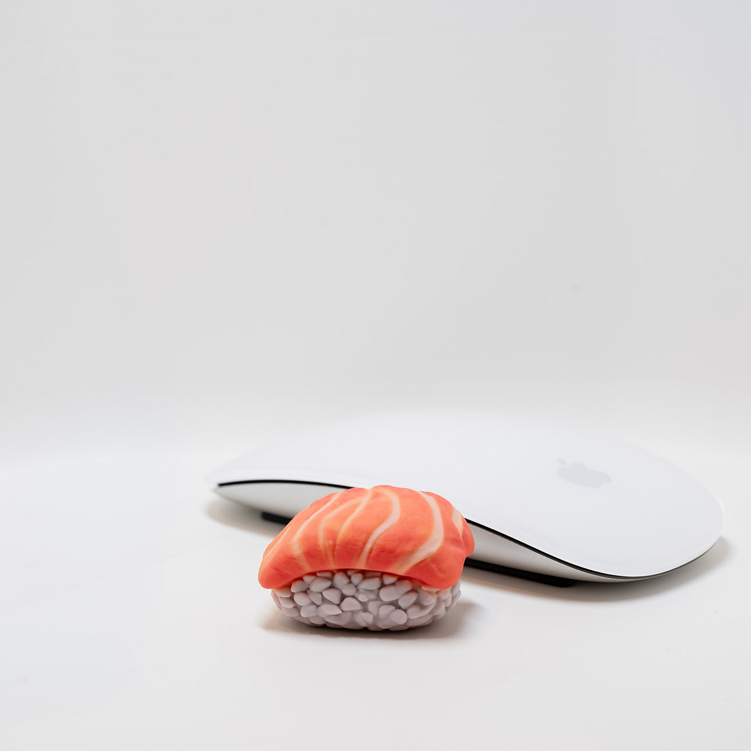 Full-color salmon nigiri print next to a computer mouse for scale
